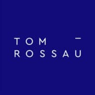 TOM ROSSAU logo
